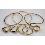 Three 9ct yellow gold bangles, to include a 'snake' example, gross weight 15.