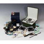 A quantity of assorted costume jewellery to include; necklace and earrings suites,