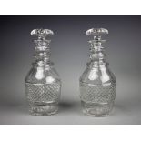 A pair of early 19th century cut glass decanters and mushroom stoppers, with hob nail cut detailing,