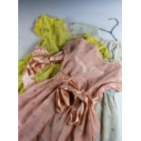 Three early 20th century girls day dresses, age approx 2/3, each in a different pastel tone,