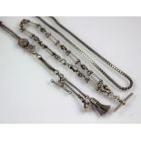 A decorative white metal albertina chain, set with embossed beads,