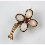 An opal and ruby set floral brooch,