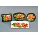 A selection of Moorcroft Hibiscus pattern items comprising; a circular bowl, 16cm diameter,