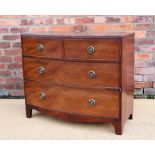 An early 19th century mahogany bow front chest, with two short and two long drawers,