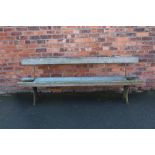 A near pair of 19th century cast iron and pine vintage tram / railway benches,