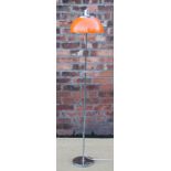 Harvey Guzzini - A 1960's orange perspex and chrome standard lamp,