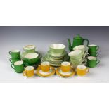An Art Deco green pinstripe decorated tea service comprising; four teacups and saucers, four plates,