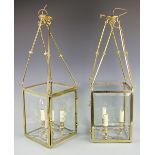 A pair of gilt brass square section hall lanterns, three light with cut glass panes,