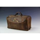 A vintage tan leather Gladstone type bag, with canvas lined interior with divider,