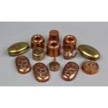 A small selection of copper moulds and snuff boxes,