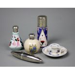 A selection of scent bottles, to include; a silver mounted scent bottle with swallow detail,