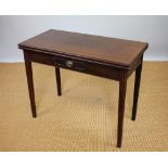 A George III mahogany tea table, with folding top above a small drawer, on tapered legs,