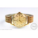 A gentlemans 9ct gold Rolex wristwatch 1950's, the champagne dial with gilt numerals 12, 2, 4,