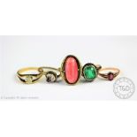 A collection of five rings, comprising; a garnet set ring,