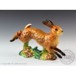 A Beswick Hare/running, model number 1024, designed by Arthur Gredington, issued 1945-1963, 12.