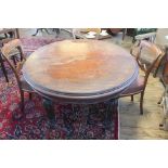 A Victorian mahogany extending oval dining table, on turned and gadrooned baluster legs,