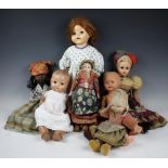 A selection of nine assorted dolls to include a Norah Wellings felt example, 33cm high,