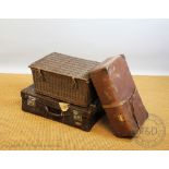 An early 20th century leather clad travelling case,