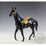A Beswick Mountie Stallion, designed by Graham Tongue, model number 2431, black gloss,