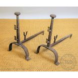A large pair of 19th century wrought iron fire dogs,