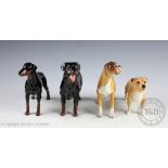 A collection of four Beswick dogs, each boxed, comprising; Doberman, No.