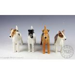 A collection of four Beswick dogs, comprising: Bull Terrier 'Romany Rhinestone', 13.