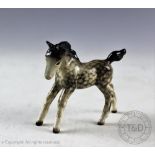 A Beswick foal (small, gamboling left), model number 996, designed by Arthur Gredington, issued c.