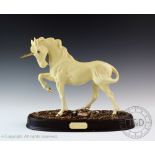 A Beswick Unicorn, model number 3021, designed by Graham Tongue, cream matte, 23.