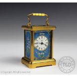 A Halcyon days miniature carrige timepiece, the turquoise dial enamelled with white bell flowers,