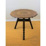 An Arts & Crafts carved oak tilt top table, possibly Cornish / West Country,