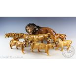 Two Beswick tigresses, model number 1486, 11cm high, a Beswick lioness, 12cm high,