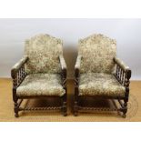 A pair of 1920's oak salon chairs, with upholstered back, seat and arms,