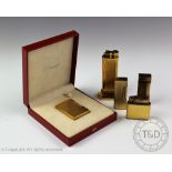 A collection of lighters, comprising; an S J Dupont, Paris lighter numbered '185ER73',