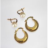 A pair of untested pearl set earrings with yellow metal fittings,
