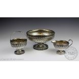 A three piece white metal strawberry set, probably American stamped 'Sterling',