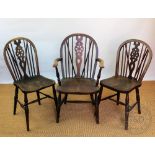 Three beech and ash wheel back Windsor chairs, including one with arms,