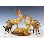 A Beswick deer family comprising Stag-lying model number.