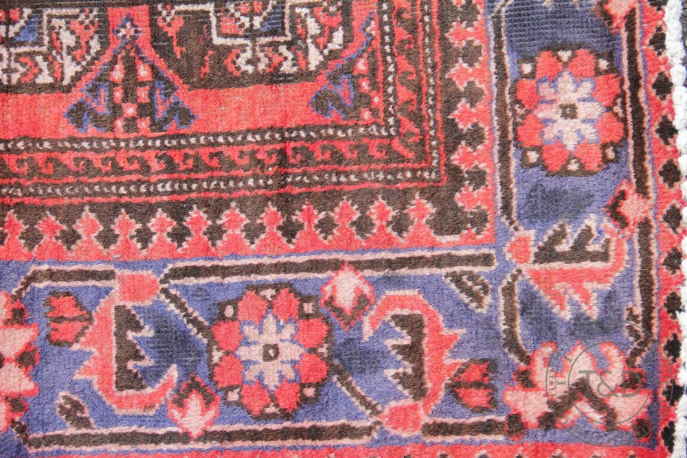 A Caucasian Bokhara wool runner, worked against a red ground, - Bild 2 aus 3