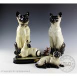 Two Beswick Siamese Cats (seated, head up), model number 2139, designed by Mr Garbet,