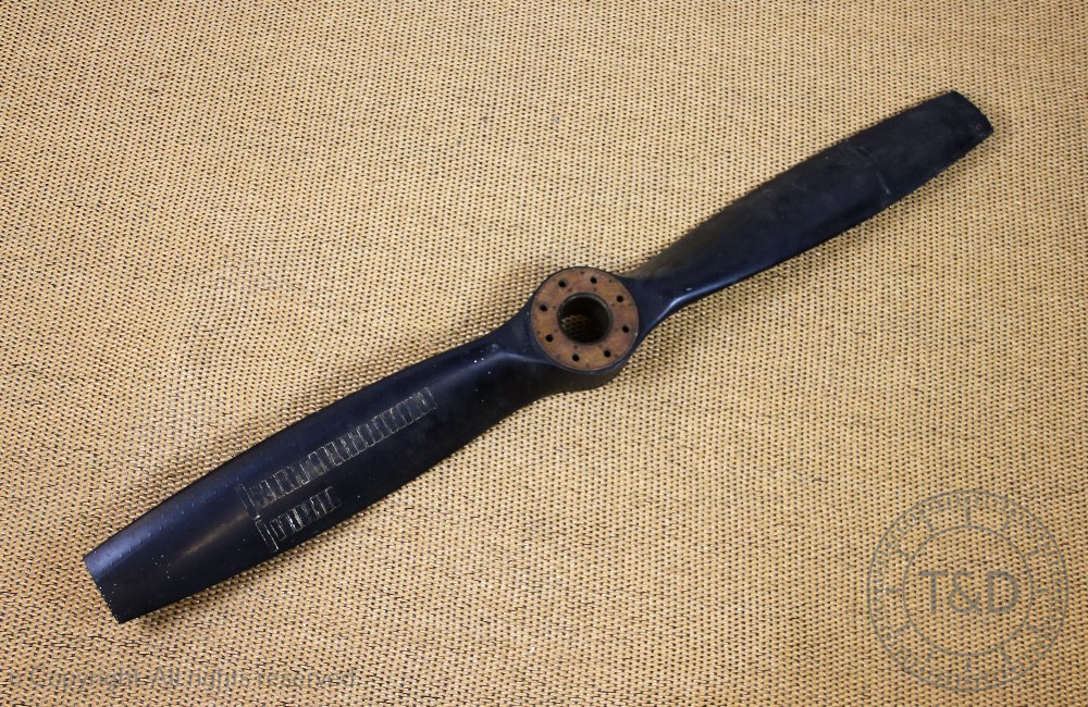 A solid wood propeller, the hub stamped DRG L.A. 505/AC44, D5.87.P.3.