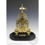 A 19th century brass fusee skeleton clock with silvered Roman numeral chapter ring,