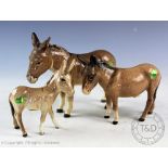 A Beswick Donkey family comprising two donkeys and a donkey foal (3) CONDITION REPORT: