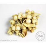 A Victorian ivory carved lily of the valley brooch,
