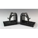 A pair of Art Deco style marble book ends, each modelled with a spelter terriers, 10.