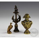 Three desk seals, comprising; a gilt metal eagle modelled perched upon a rock,