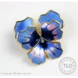 A silver gilt and enamelled double peony brooch by David Anderson,