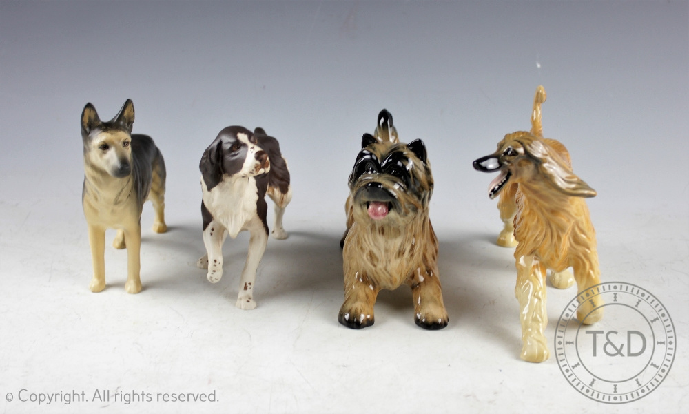 A collection of four Beswick dogs, each boxed, comprising; Alsatian 'Ulrica of Brittas' No.