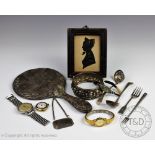 A selection silver to include sugar sifter spoons, a hand mirror, pickle forks, a whisky label,