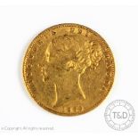 A Victorian gold shield back sovereign dated 1869, London Mint, young head,