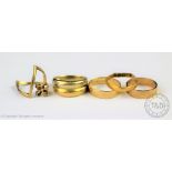 Two 9ct yellow gold wedding bands and a 9ct yellow gold 'wishbone' ring, gross weight 5.